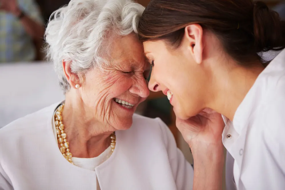 Senior Woman and Adult Daughter embracing each other