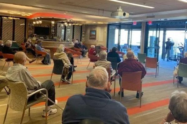 Residents Enjoying a Brass Quartet Musical Concert During Social Hour