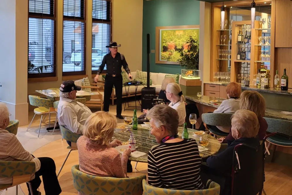 Residents Enjoying a Glass of Wine While Listening to Country and Motown Favorites With Gary Pillow