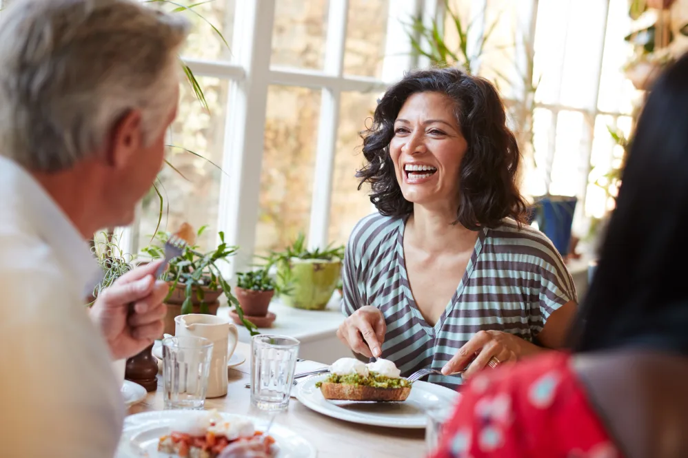 Woman smiling across the table