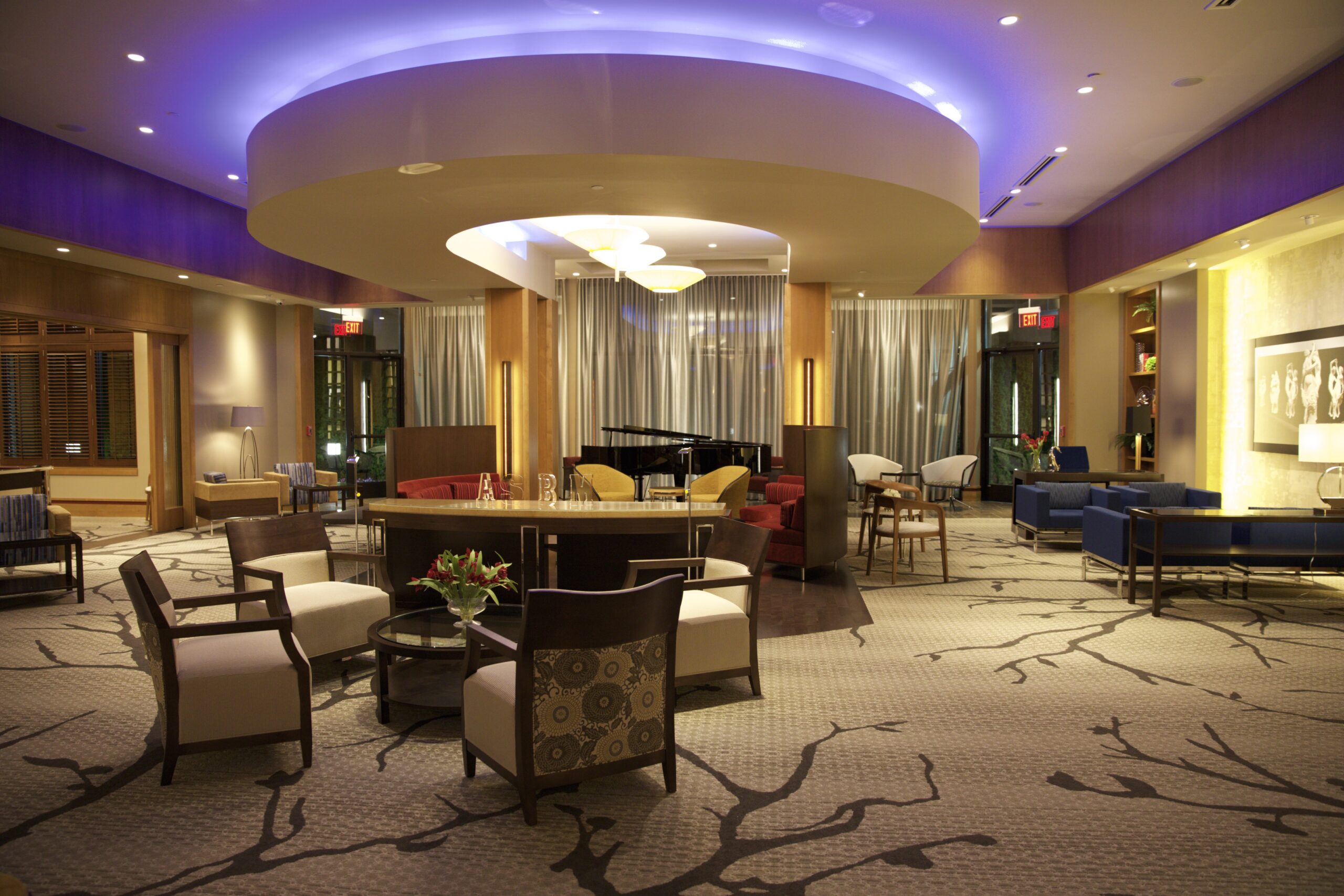 Dining room with purple overhead lighting