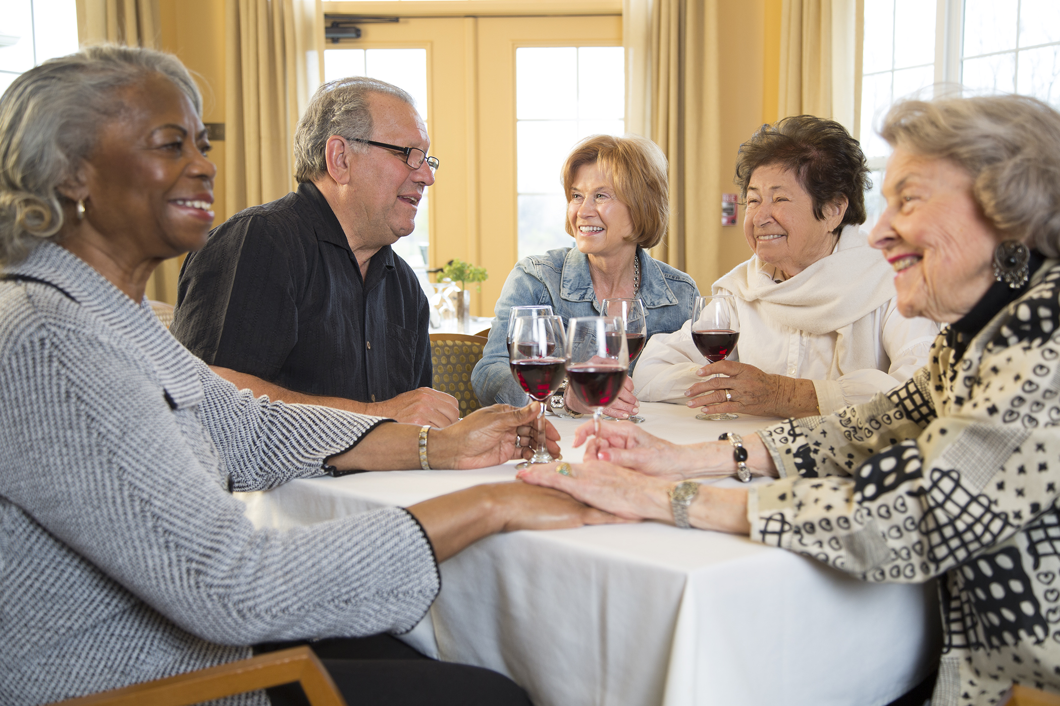 group of seniors drinking wine