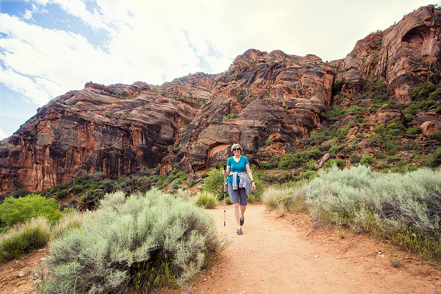 A senior solo hiking enjoying the Catalina Mountains in Arizona.