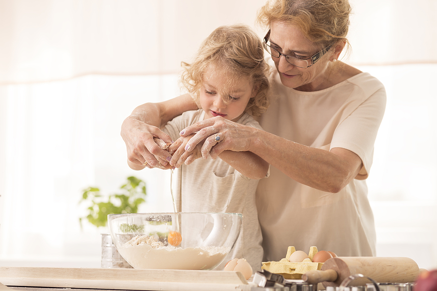 Family cooking together—sharing family recipes with senior loved ones