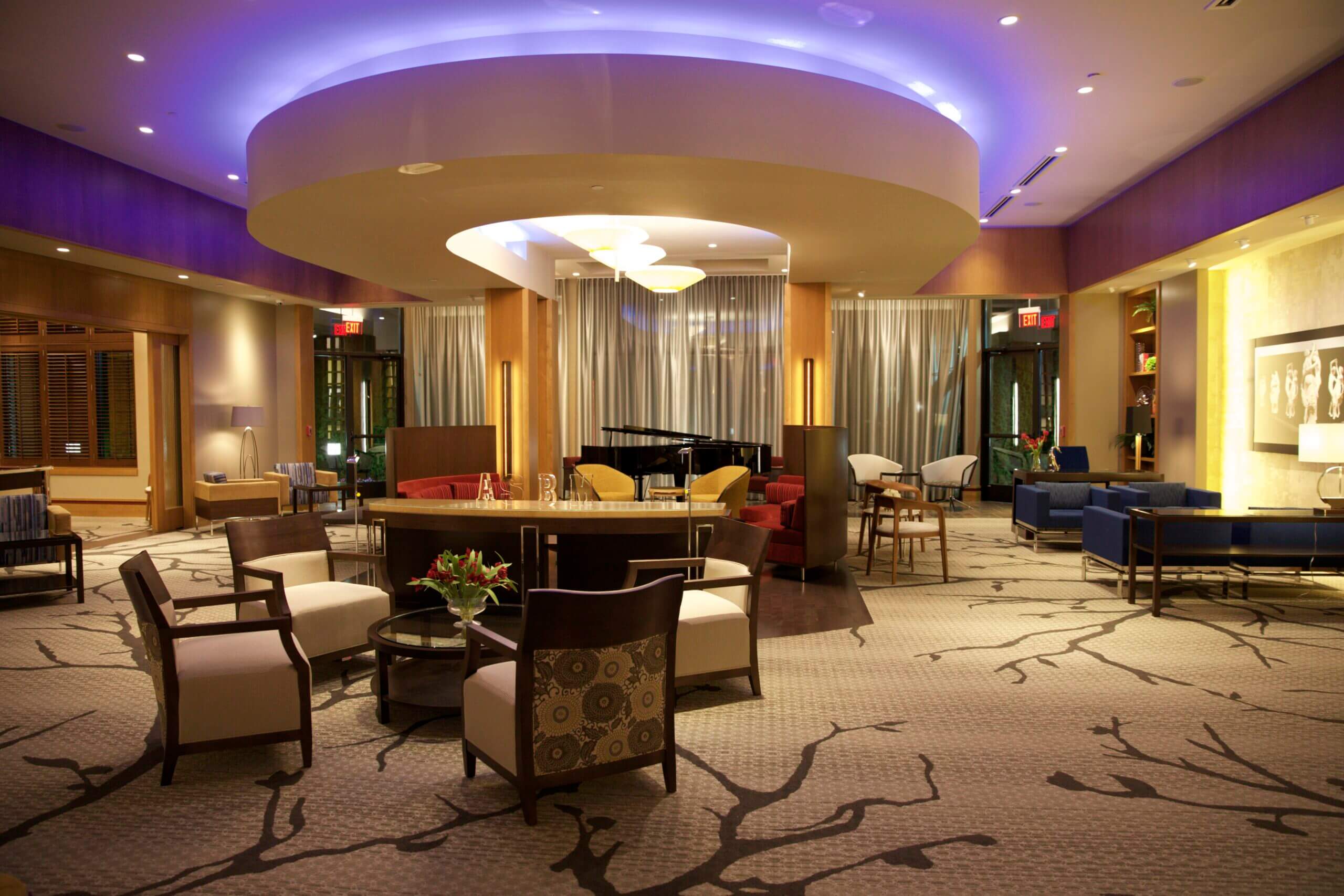 Dining room with purple overhead lighting