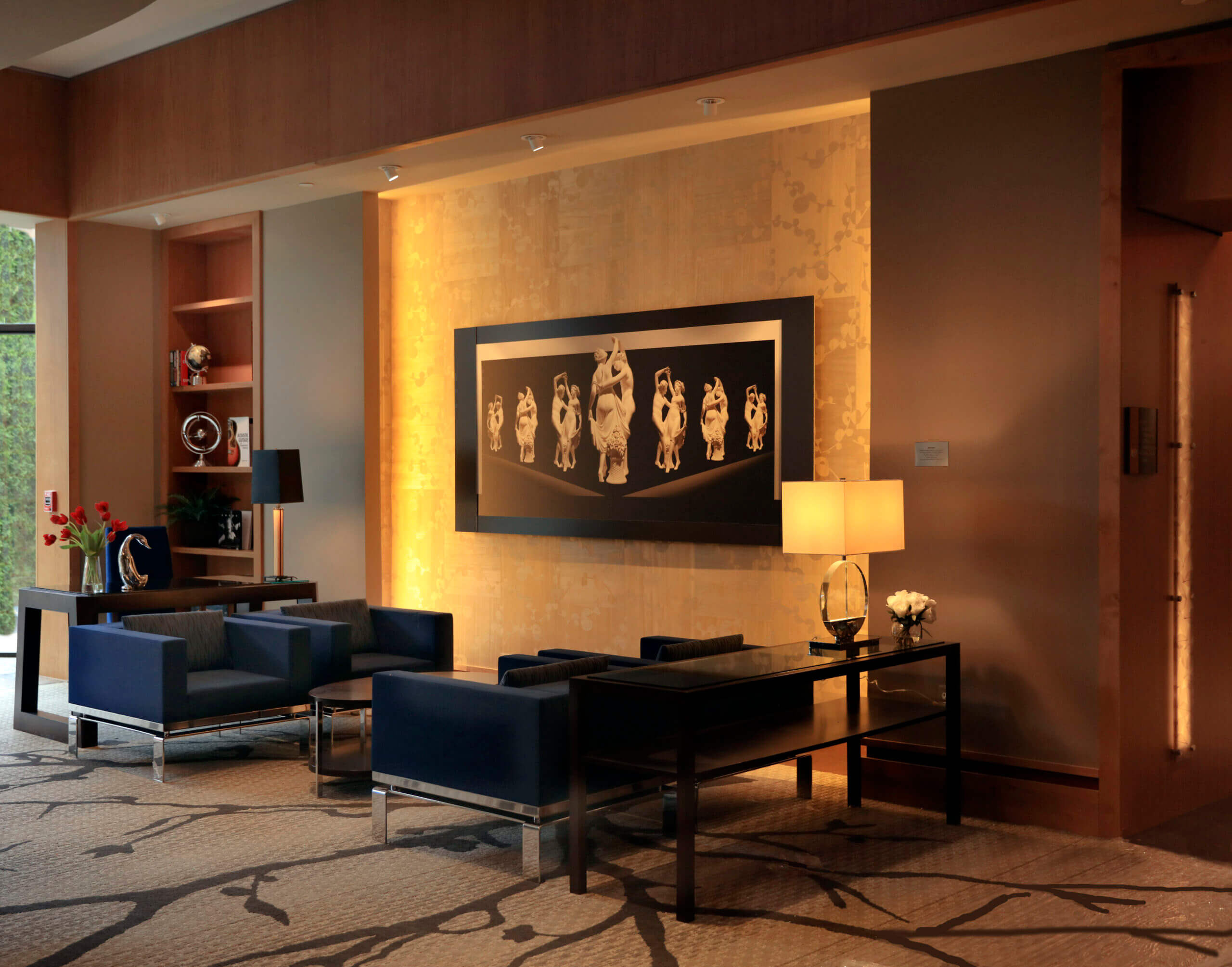 Seating area in common area at All Seasons Birmingham that is dimly lit