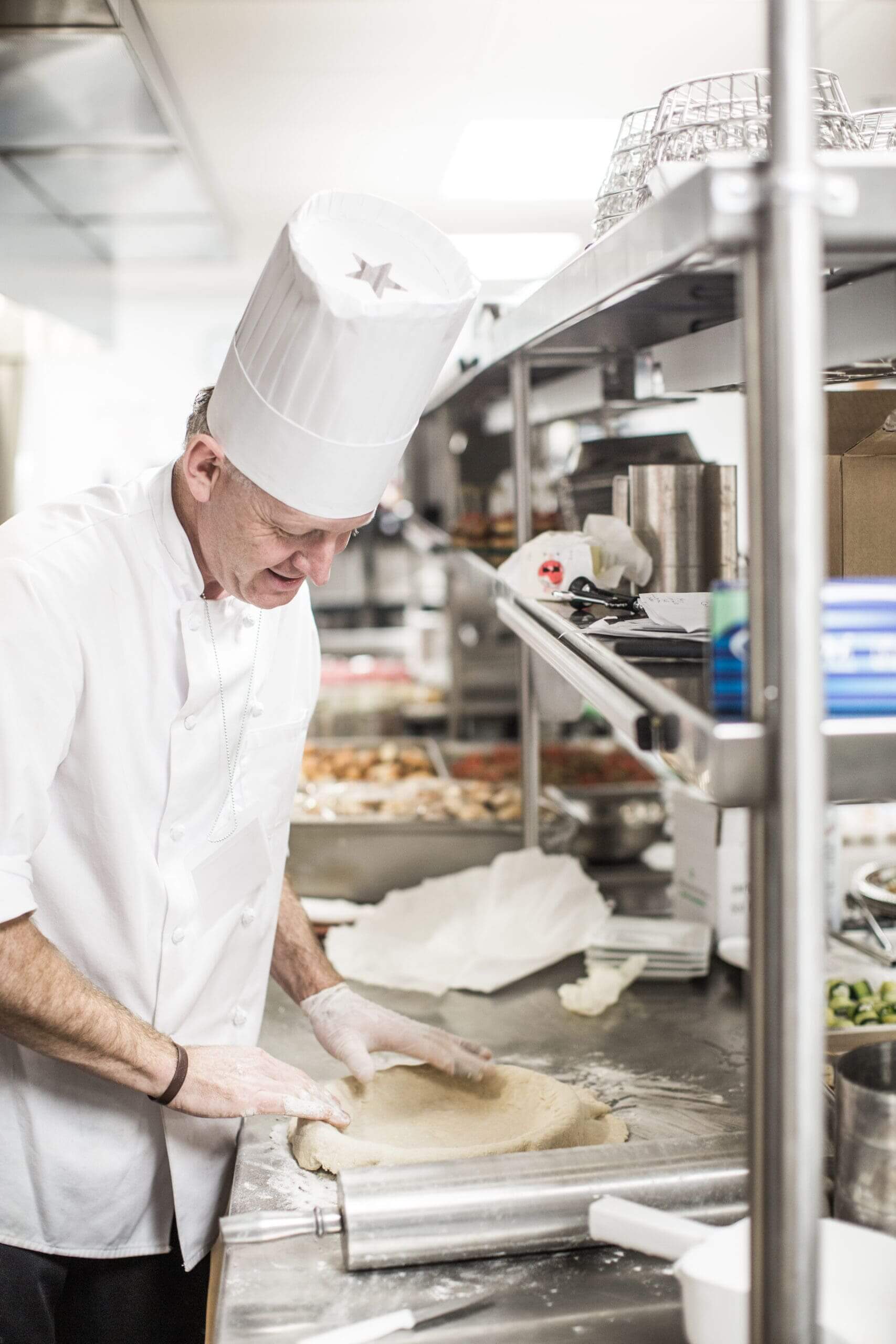 Chef preparing dinner for seniors
