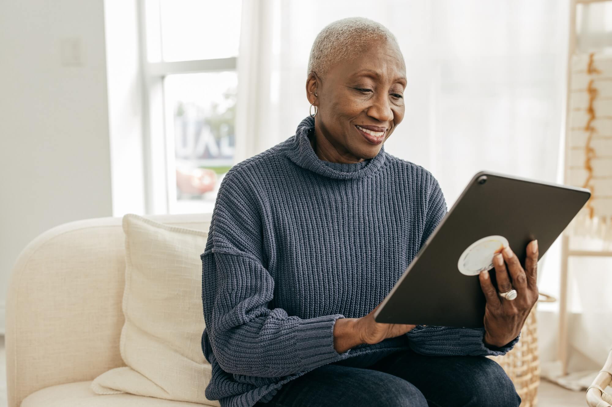 Senior Woman on large ipad