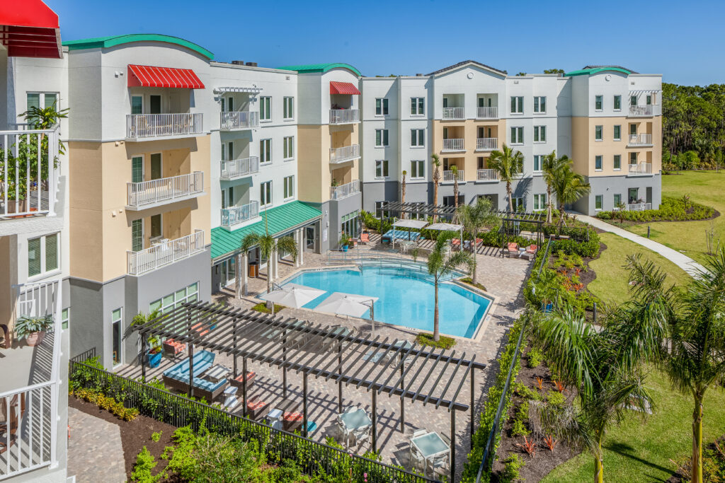 An aerial shot of the outdoor pool and amenities at the beautiful All Seasons community in Naples, Fl.