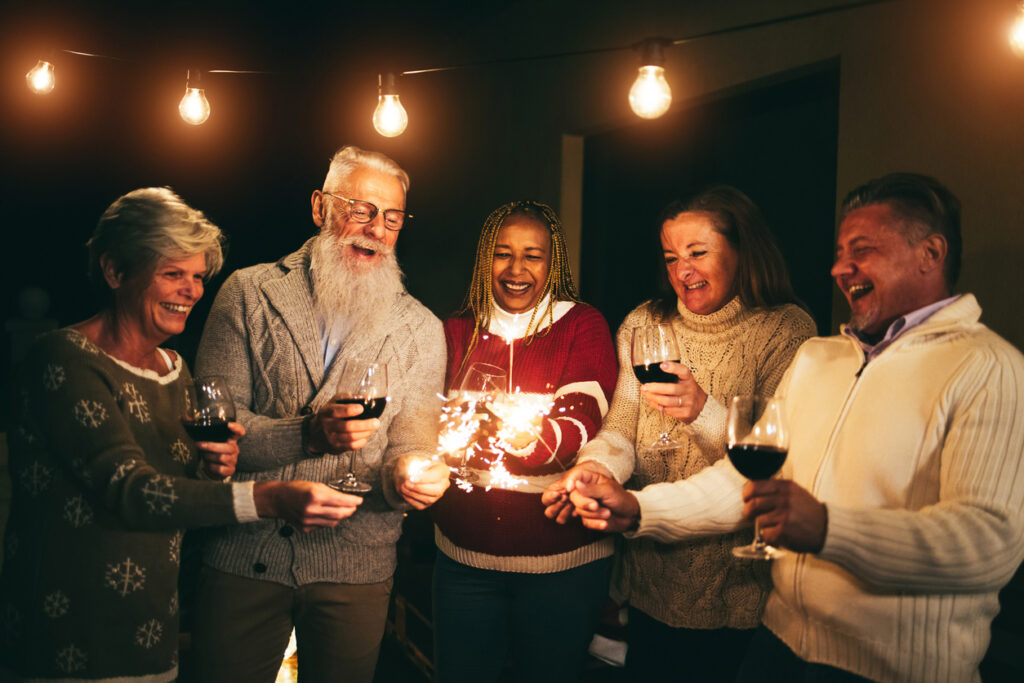 Soft focus photo of an evening Holiday celebration, brought to life by All Seasons Senior Living’s thoughtful programming.