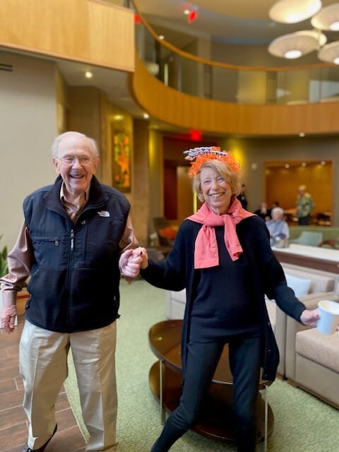 Senior couple happy and holding hands at All Seasons retirement community